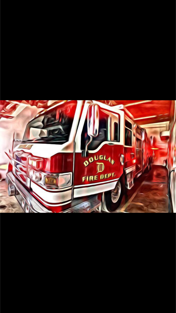 Shimmering Photo of Doulgas Fire Truck Sitting in Garage